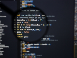 Lines of Python code visible under magnifying lens.