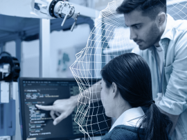 people working at a computer in a lab